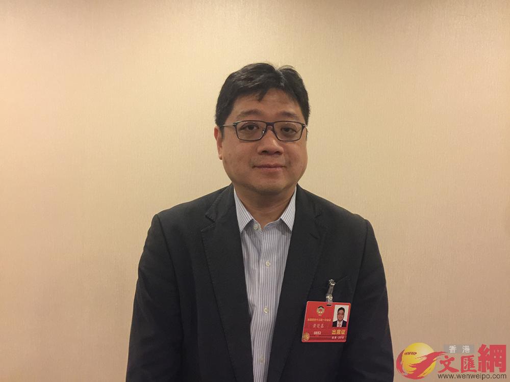 全國政協委員、香港僑界社團聯會副會長兼秘書長黃楚基。葛沖攝。