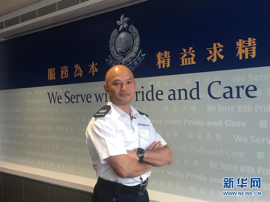 9月13日A香港警務處機動部隊警署警長劉澤基在香港警察總部接受記者採訪C新華社